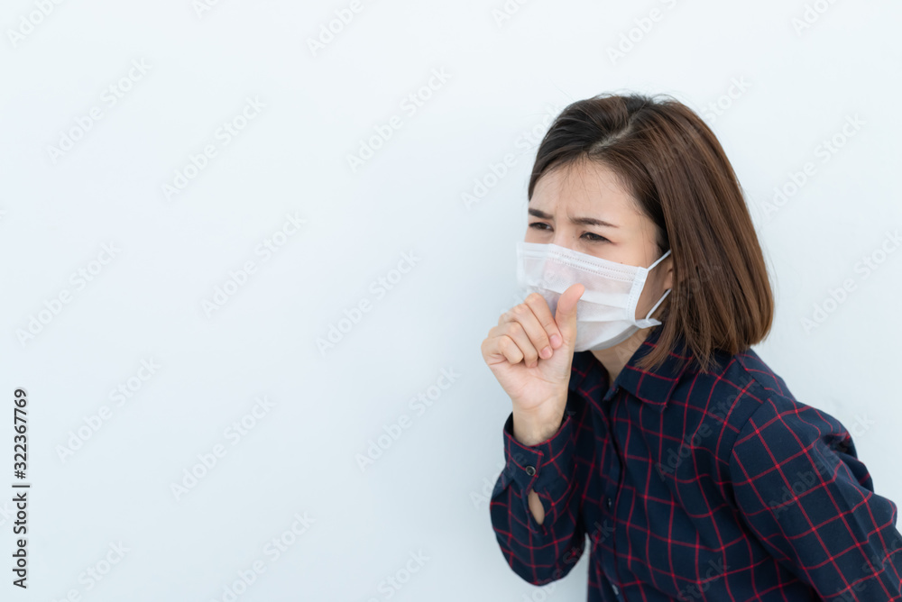 Asian traveler woman wear mask for protect coronavirus,Thai woman wearing face mask respiratory protect and filter pm2.5 (particulate matter)