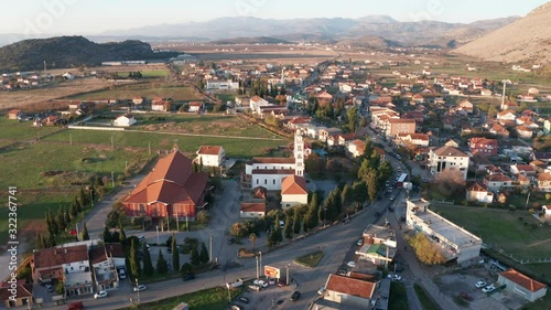Tuzi, the youngest municipality in Montenegro, in the afternoon, close to sunset. Center of Malesi e Madhe District, populated mainly by Malisors. Aerial fly over shot. photo