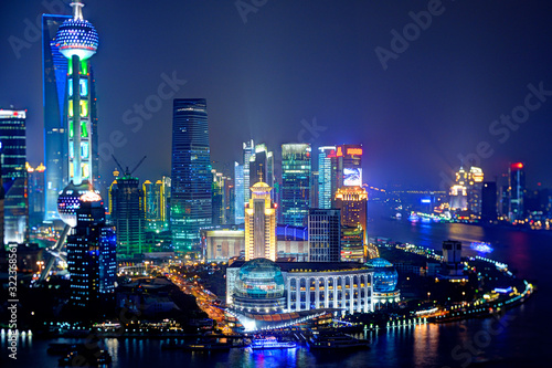Unusual view Shanghai financial district by night, taken with special lens, only central part is in focus.