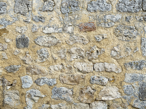 wall of large exposed stones belonging to a medieval castle