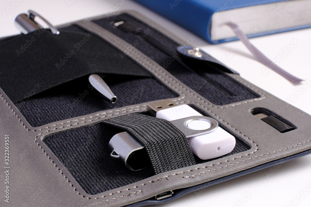 Organizer for business. Selective focus. Handle, battery charger for flash cards. Organizer for business. Selective focus. Handle, battery charger for flash cards.