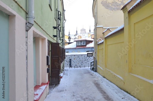 Literatu Street - oldest streets in the Old Town of Vilnius, Lithuania. The walls of street are decorated with dedications to writers, poets, translators. photo