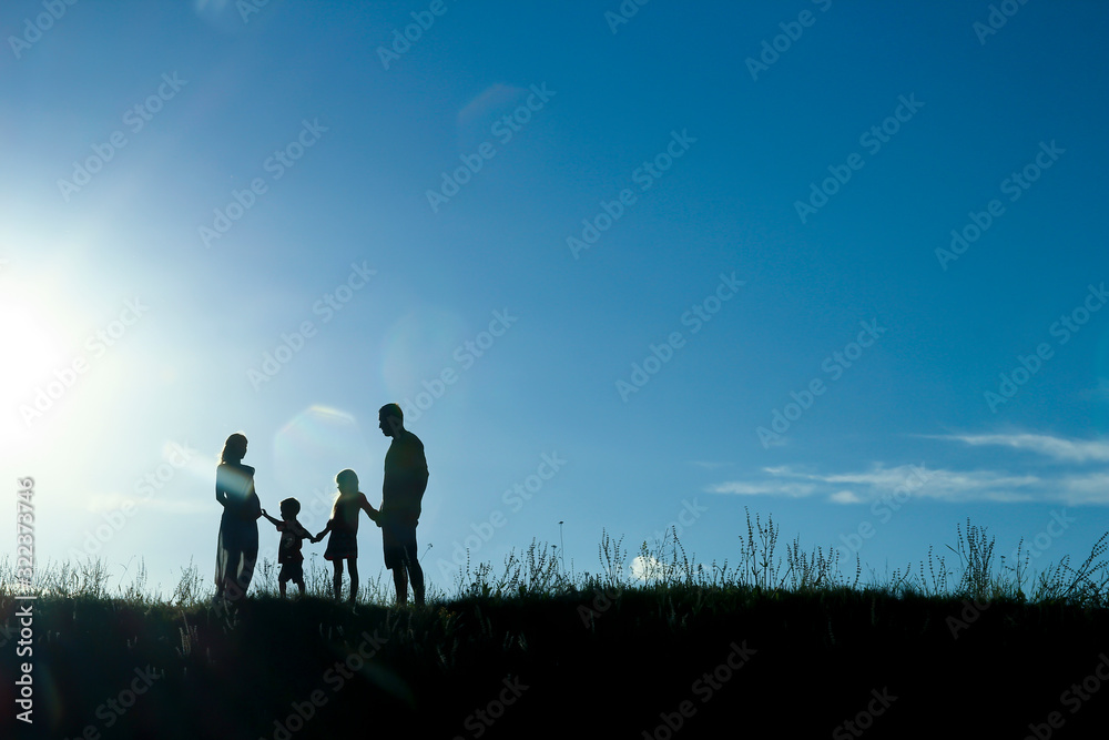 silhouette of a happy family with children