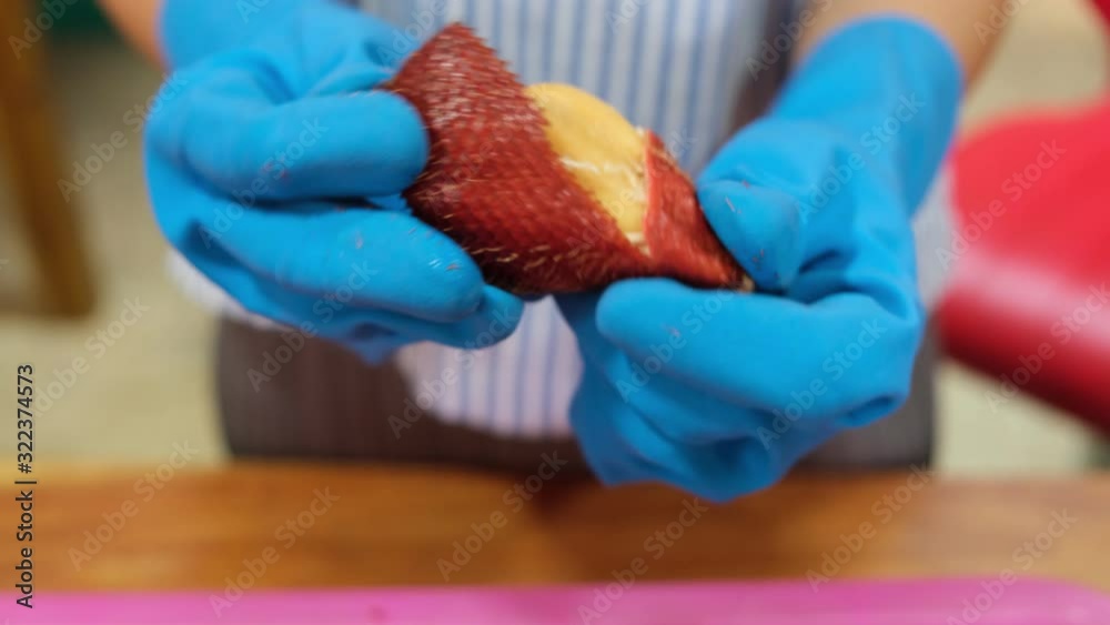 trick and technic peeling red salak or zalacca fresh fruit by female hand