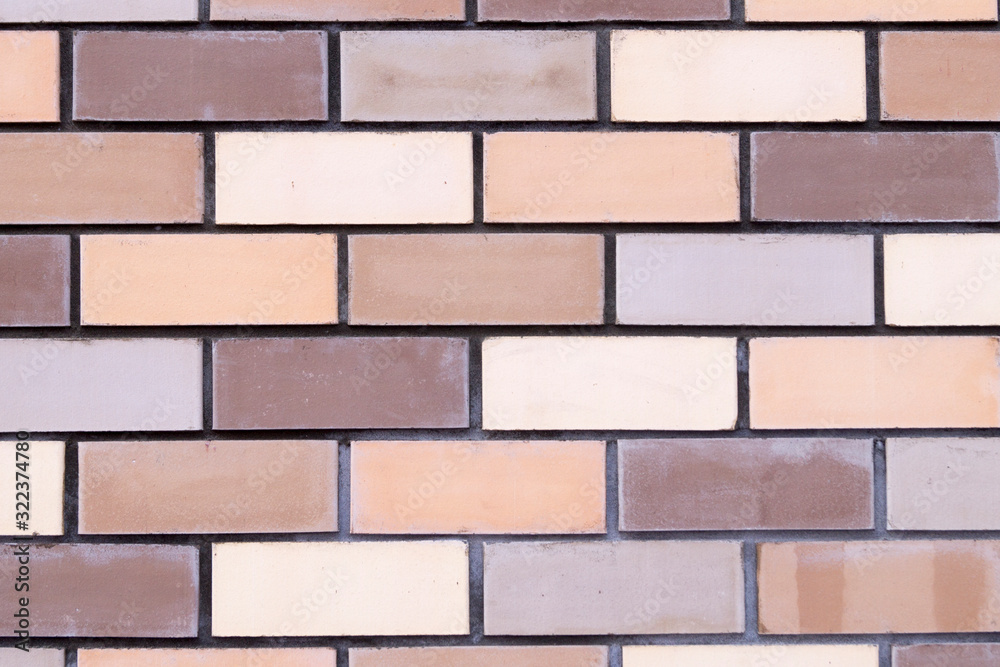 Fototapeta premium multi-colored brickwork for background closeup