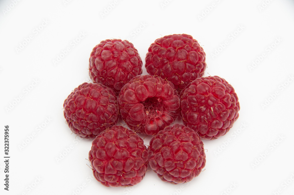 Red raspberries in the form of a hexagon on a white background Red raspberries in the form of a hexagon on a white background