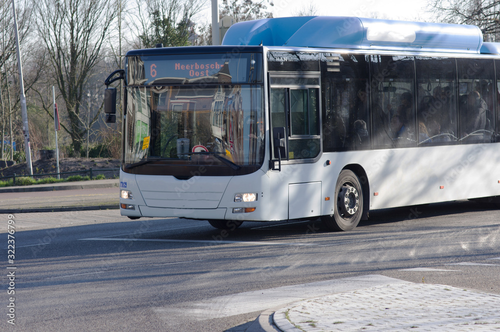 Public transport bus on the road in the center of Nijmegen