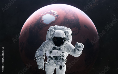 Astronaut and Mars. Red planet of the solar system. 3D render. Science fiction. Elements of this image furnished by NASA