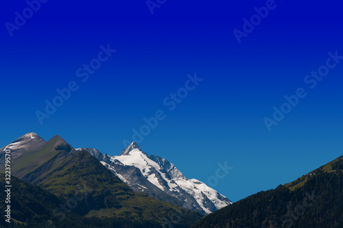 alpine peak of Grossglockner mountain in Austria. blue sky background for your text