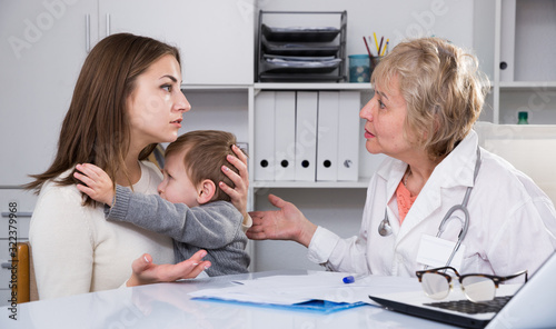 Adult female is puzzled of diagnosis of her son from woman doctor