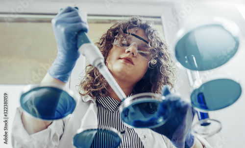Fotografie Young scientist working at the lab