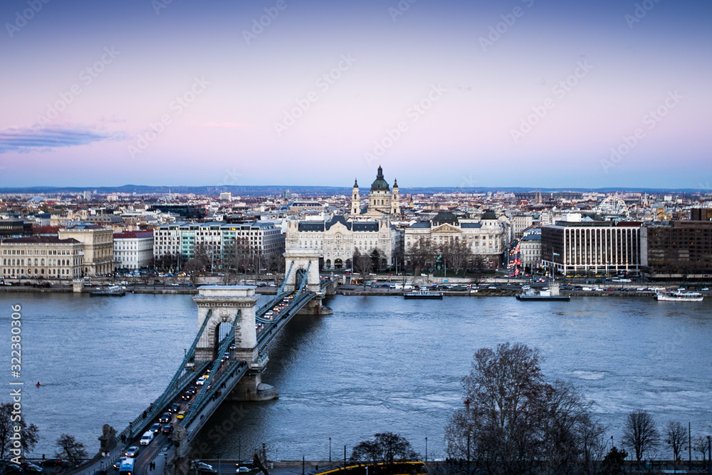 The Széchenyi Chain Bridge is a chain bridge that spans the River Danube between Buda and Pest, the western and eastern sides of Budapest, the capital of Hungary.