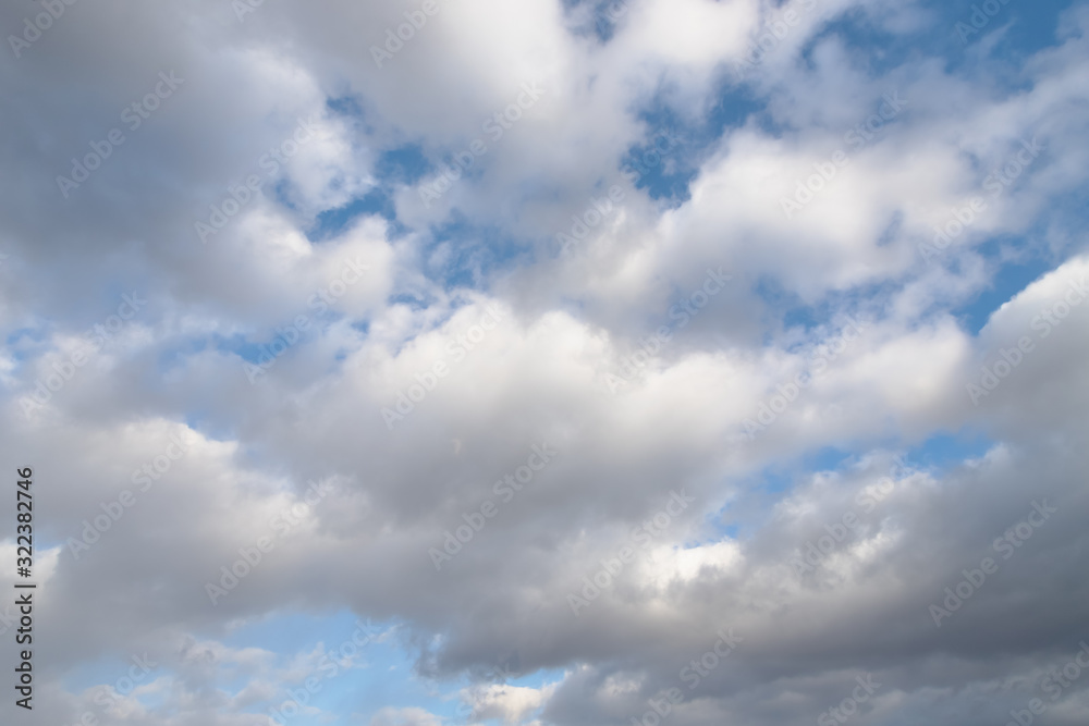 White and gray clouds in the sky. Beautiful sky background