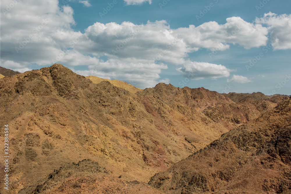 desert mountains sharp sand stone rocks and cliffs wilderness nature background scenic view of south Israel country side environment