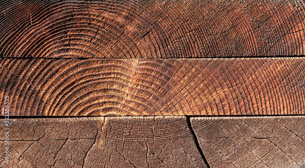 Fototapeta premium 3 Lumber Boards stacked and showing end grain on construction site in Upstate NY
