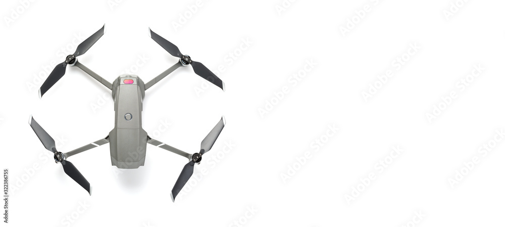 Modern drone quadcopter with a camera isolated on white background. Top view. Free space for your text Modern drone quadcopter with a camera isolated on white background. Top view. Free space for your text