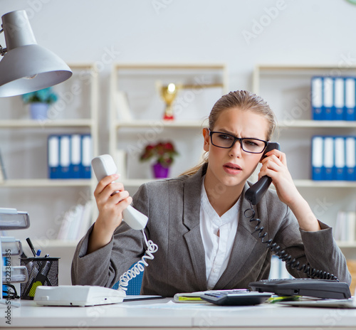 Young businesswoman accountant working in the office photo