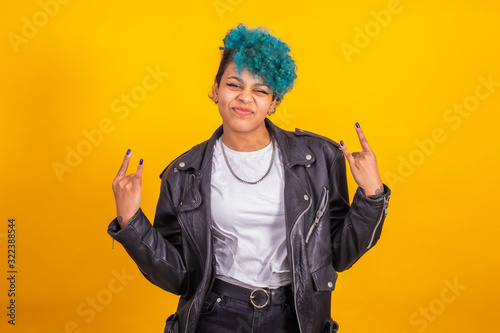 Fototapeta modern young girl with rebel expression isolated on color background