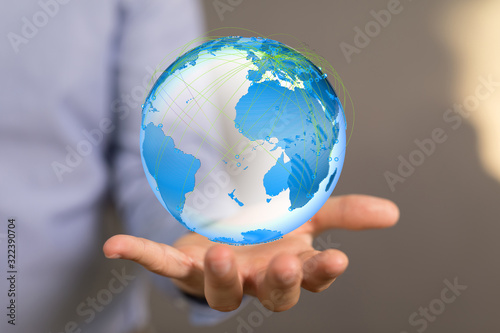 Human Hand Holding The World In Hands.