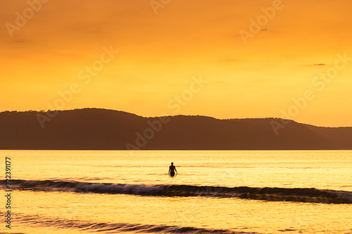 Summer Dawn Seascape and Swimmer Silhouette