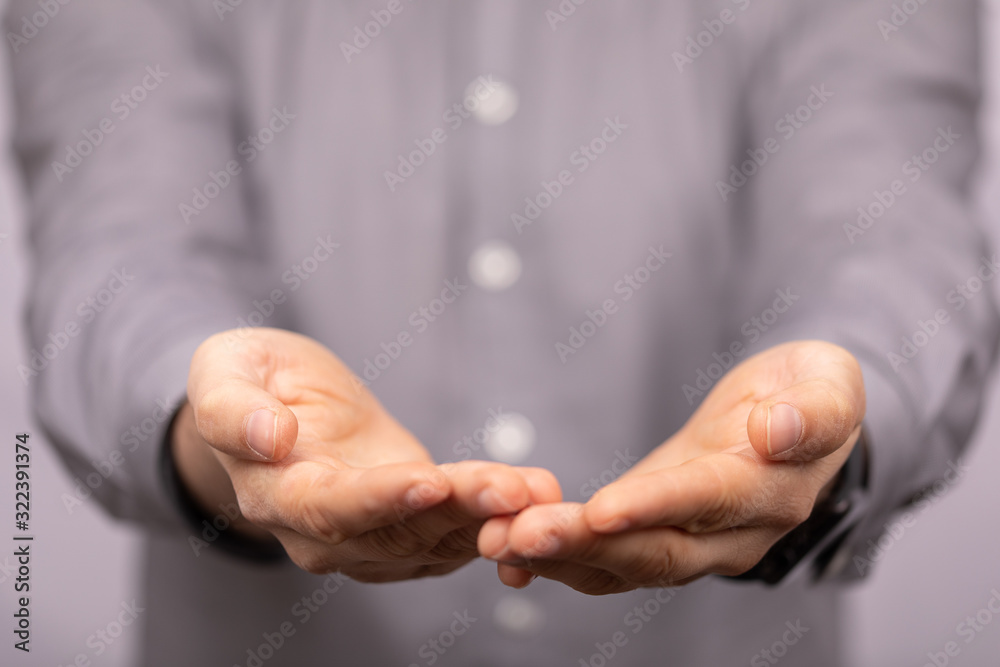 Obraz premium Businessman without head holding something without theme