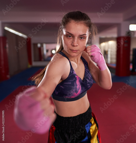 Kickboxer girl shadow boxing