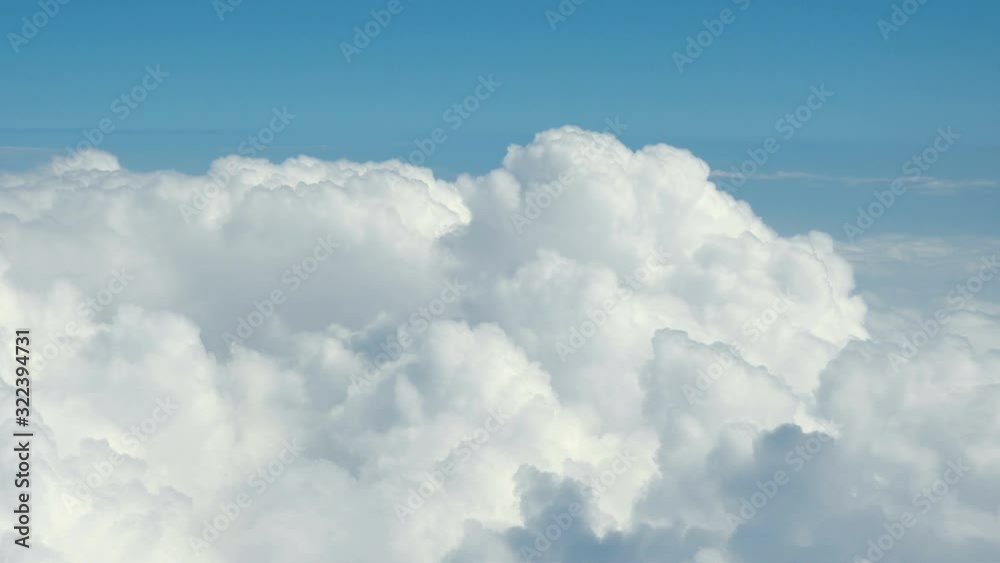 Aerial shot above the clouds in 4K