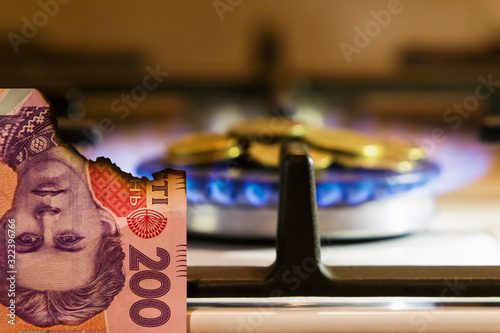 Gas burner with fire and currency.