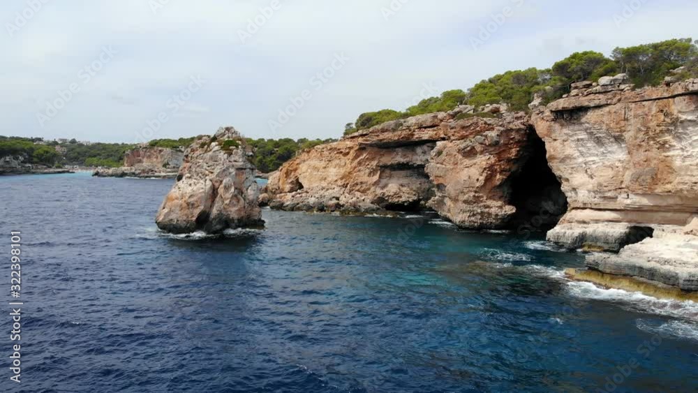 Amazing cliffs around the northeast of Mallorca. Cap de Formentor. Spain. A soft waves hitting on the cliffs. Amazing cliffs around the northeast of Mallorca. Cap de Formentor. Spain. A soft waves hitting on the cliffs.