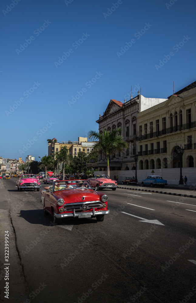 colored cars on the road in Havana