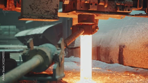 Molten metal is pouring on a steel casting foundry