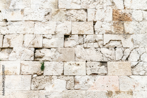 Antique stone wall in the Acropolis of Athens. Brick wall background