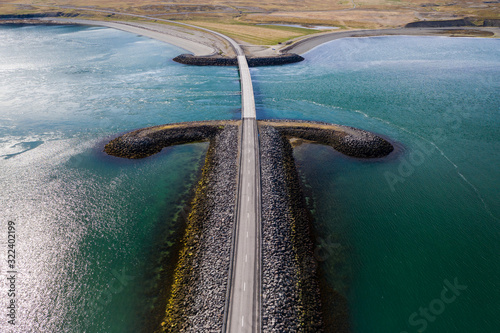 Scenery icelandic road and Kolgrafafjordur bridge over sea photo