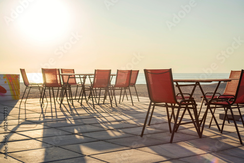 Tables in a restaurant or resort by the sea beach. Restaurant by the sea