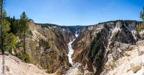 panoramic picture of the lower falls waterfall on a sunny day in the yellowstone national park, wyoming, united states of america photo