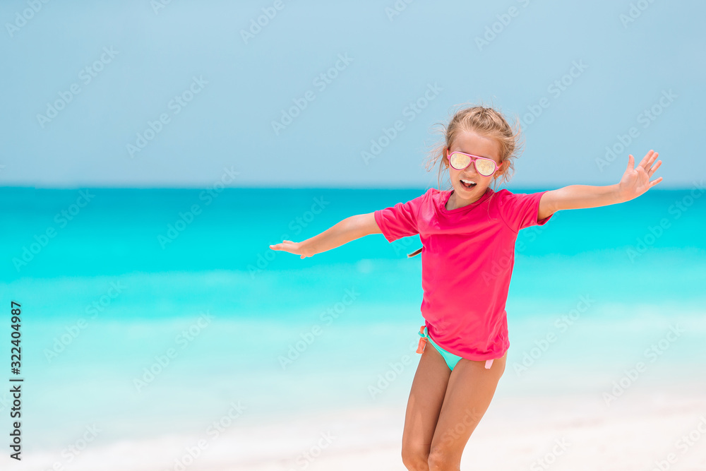 Cute little girl at beach during summer vacation Cute little girl at beach during summer vacation
