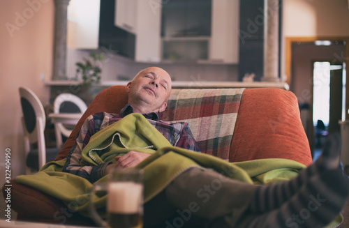 Old man napping at home