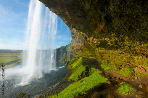 Amazing rear view of  Seljalandfoss waterfall in sunny day
