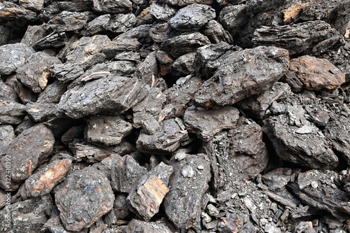 A stack of dry lignite coal ready for heating 