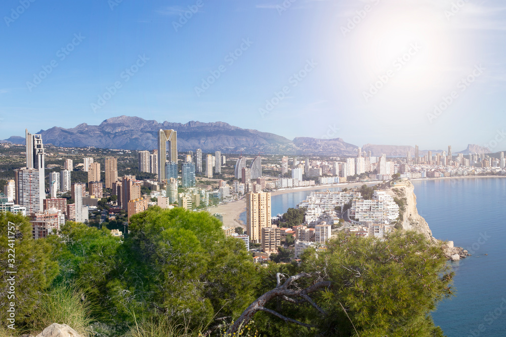 Breathtaking view of the coastline in Benidorm with high buildings, mountains and sea