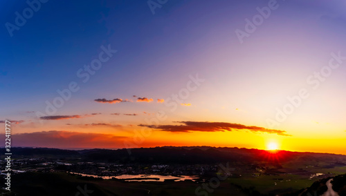 Sunset in the Mountains, valley over Lake, panorama 