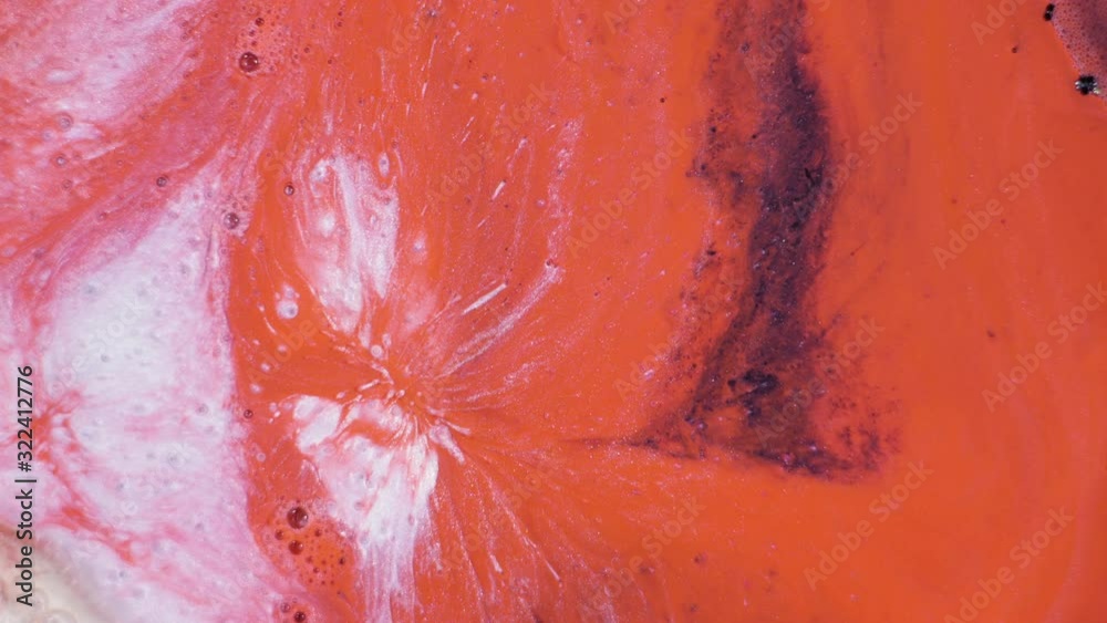 Beautiful abstract orange and black background with bright bubbles of bright paint. Beauty design background. Liquid makeup foundation moving close-up. Macro 4K UHD video Beautiful abstract orange and black background with bright bubbles of bright paint. Beauty design background. Liquid makeup foundation moving close-up. Macro 4K UHD video