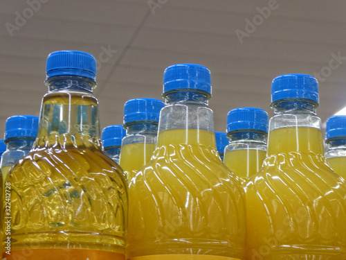 Rows of dilute juice drink bottles