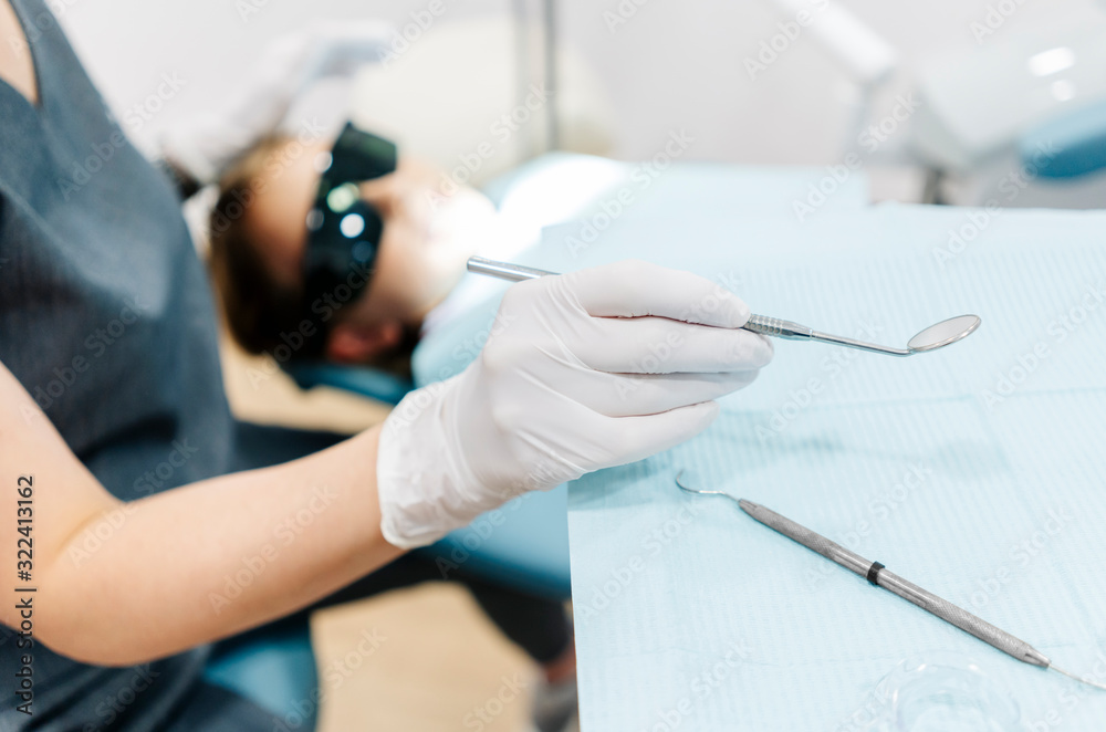 Girl at the dentist receiving treatment Girl at the dentist receiving treatment