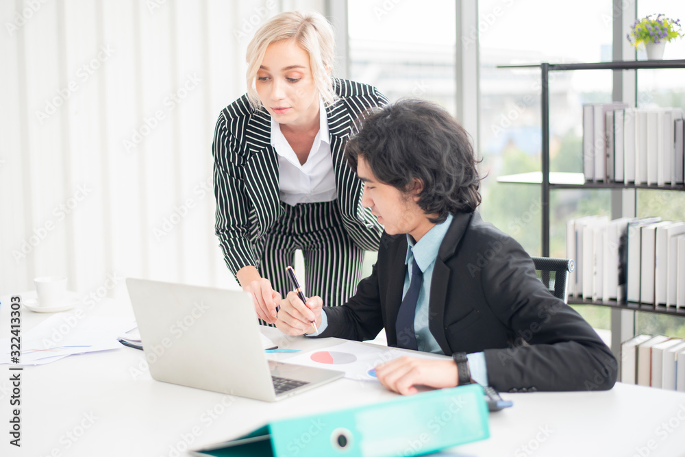 Business people are analyzing financial report Business people are analyzing financial report