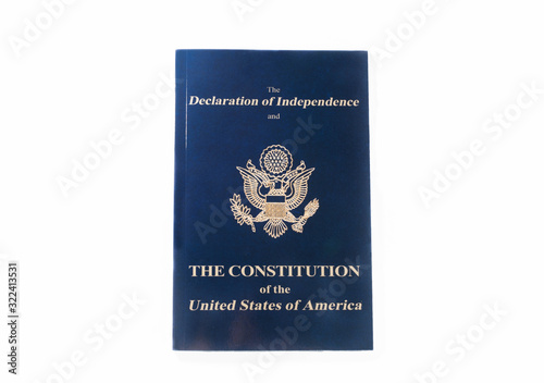 top view of blue booklet with declaration of independence and constitution of usa isolated on white