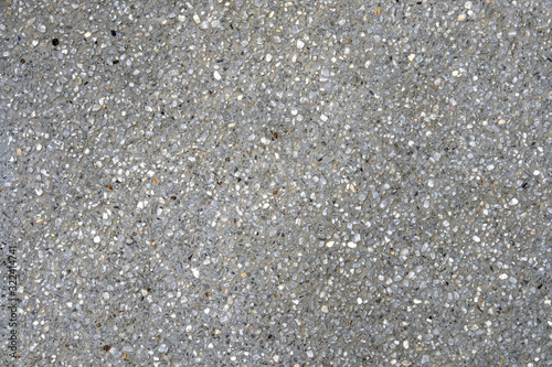 Explsed aggregate finish concrete wall and floor background texture.