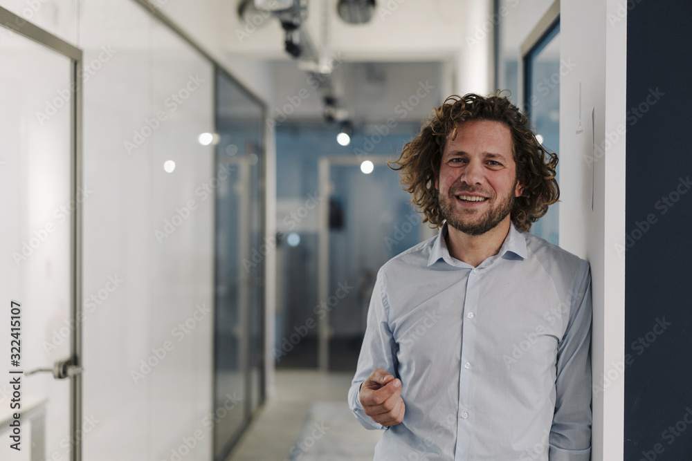 Portrait of confident businessman in office Portrait of confident businessman in office