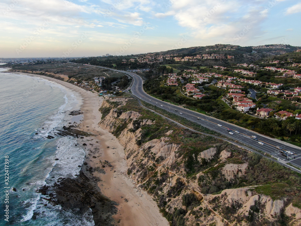 Aerial view of Newport Beach small road next to the cliff during sunset twilight in southern California, USA Aerial view of Newport Beach small road next to the cliff during sunset twilight in southern California, USA