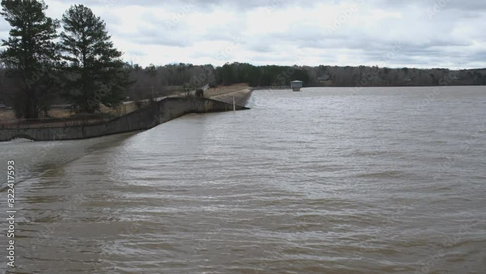 Storm water rushes over the spillway at Lake Wheeler, Raleigh North ...